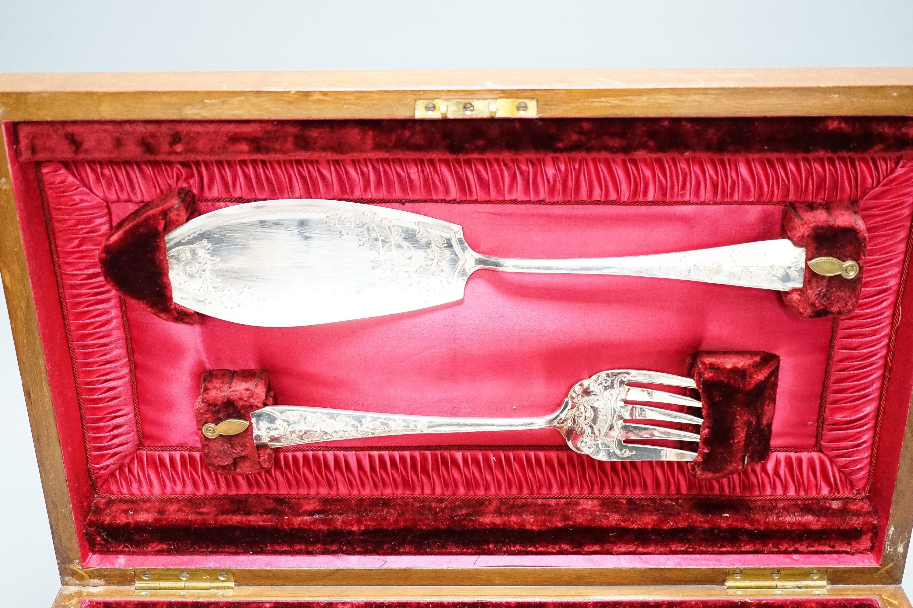 A cased set of plated engraved fish cutlery